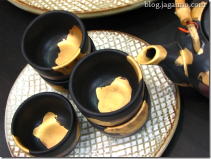 Teacups and pot with golden enameling